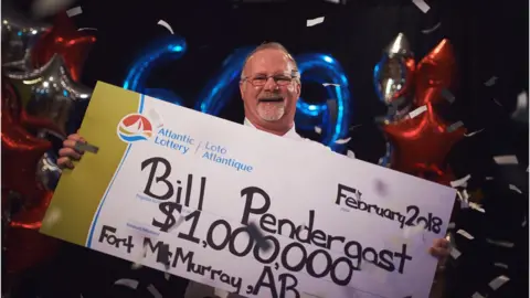 Courtesy Atlantic Lottery  Bill Pendergast with his novelty cheque