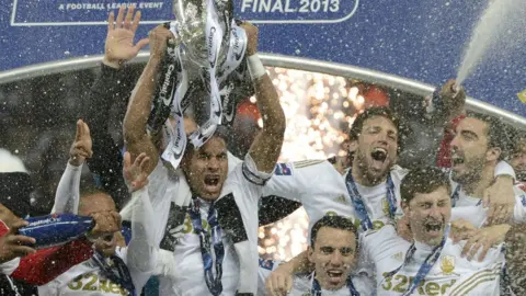 Getty Images Swansea City have enjoyed some highs during their seven years in the Premier League including winning the League Cup for the first time