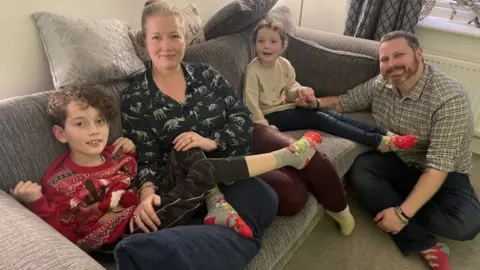 Gemma Dawson/BBC Tim and Michelle Garvey and their children Lucas, aged 11, and Penelope, aged seven