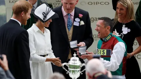 Reuters Frankie Dettori lifting trophy