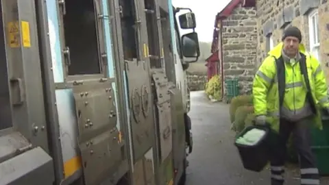 BBC A refuse collector in Conwy county