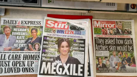 EPA British newspapers on a stand after the US television interview of Prince Harry and Meghan Markle