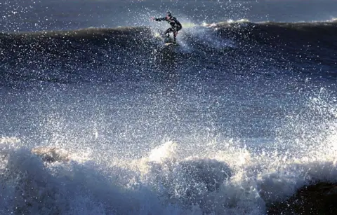 Simon Wilkin Surfer on a wave