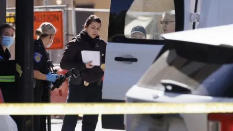 EPA Coroner's officials at the crime scene