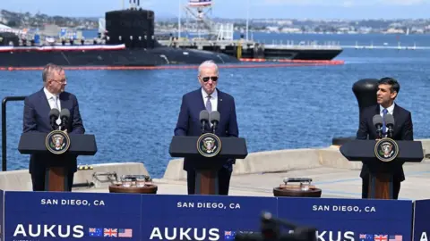 Getty Images L-R: Australia PM Anthony Albanese, US President Joe Biden and UK PM Rishi Sunak, San Diego, 13 Mar 23