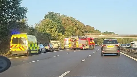 M53 crash Major incident as school bus full of children overturns