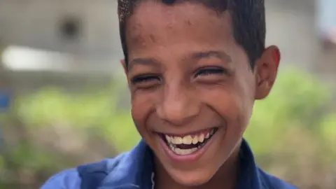 Ahmed smiling