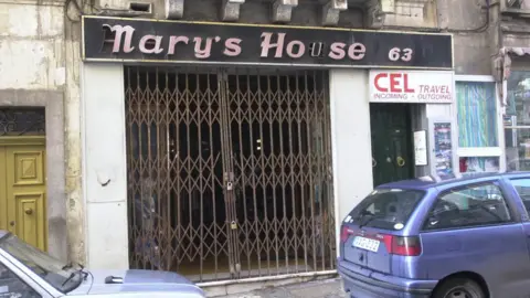 PA Media Tony Gauci's clothes shop, Mary's House, in the seaside suburb of Sliema on Malta