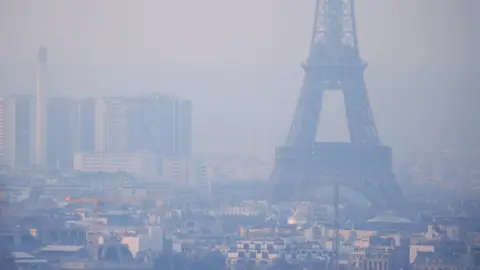 Reuters Eiffel Tower enveloped in smog (file pic)