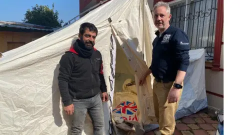 Erlend Linklater (right) at one of the many temporary camps set up in Antakya