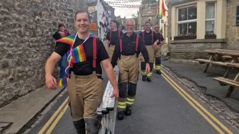 Local fire crews helping to put up bunting