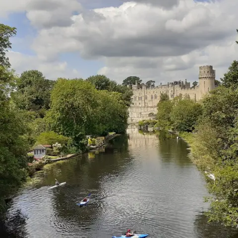 David Harvey People kayaking on the River Avon, with Warwick Castle in the background
