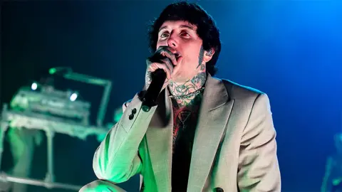 Getty Images Oliver Sykes performing