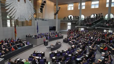 Getty Images German Chancellor Angela Merkel speaks in the Bundestag