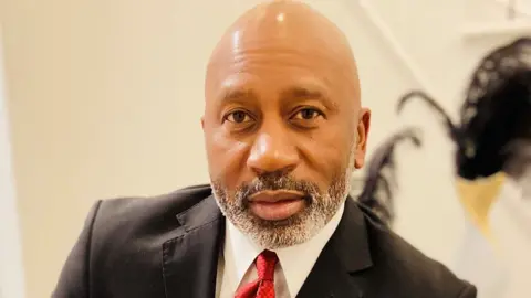 Terrance Hopkins Man poses for a photo