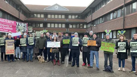 BBC People outside Gateshead Council with signs
