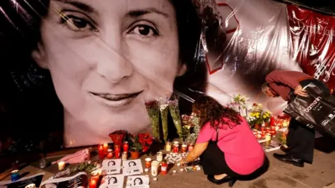 Reuters A memorial to Daphne Caruana Galizia