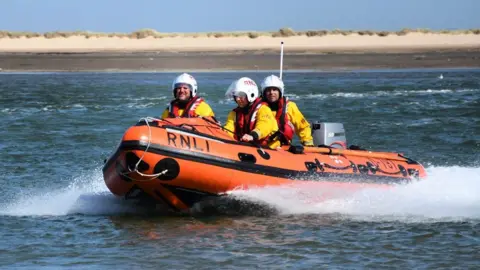 RNLI/Ray West RNLI crew from Wells-next-the-Sea in a lifeboat