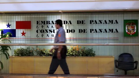 EPA A policeman guards Panama's embassy and consulate in Taipei, Taiwan, 13 June 2017