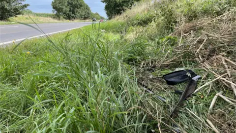 Shaun Whitmore/BBC Debris on the A413