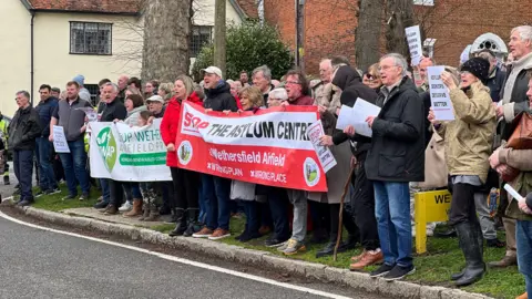 Jon Ironmonger Protesters in Wethersfield, Essex holding large banners