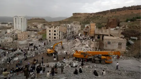 Reuters People search under rubble of a house destroyed by a Saudi-led air strike in Sanaa, Yemen (August 25, 2017)