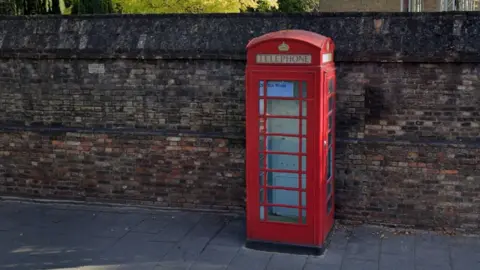 Google Red telephone box on St Andrews Street in Cambridge