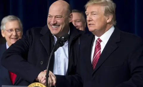 AFP US President Donald Trump shakes hands with Gary Cohn, Director of the National Economic Council, on January 6, 2018