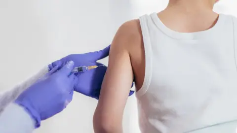 Getty Images Young boy being vaccinated