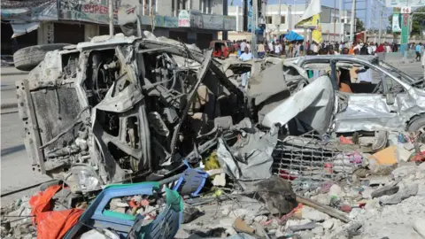 AFP This photograph taken October 30, 2022 shows a destroyed cars after an car bombing targeted the education ministry in Mogadishu on October 29, 2022