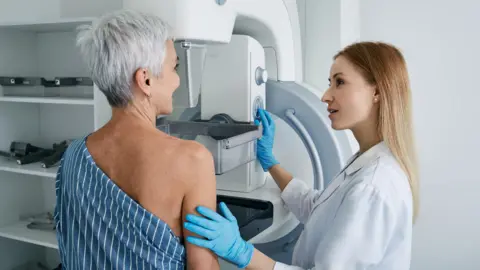 Getty Images Woman having a mammogram