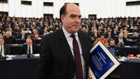 Getty Images Venezuelan opposition leader Julio Borges leaves after receiving the European Parliament's Sakharov human rights prize at the European Parliament in Strasbourg