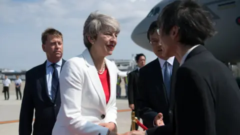Getty Images Theresa May meets Japanese dignatories