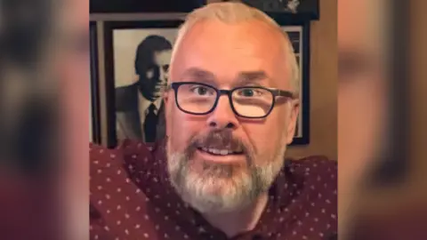 Richard Grosvenor Cllr Richard Grosvenor standing in front of a wall