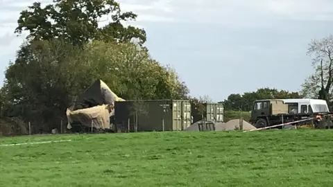 BBC Damage to a container at the Event Horizon premises