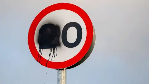 Getty Images 20mph sign sprayed with paint