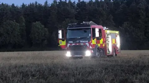 Taunton Fire Station A fire engine in a field