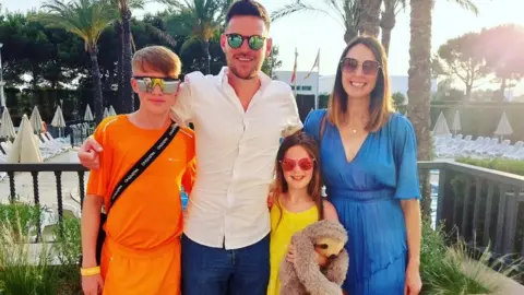 Joanne Cave Joanne with partner Alex and children Nieve and Zac