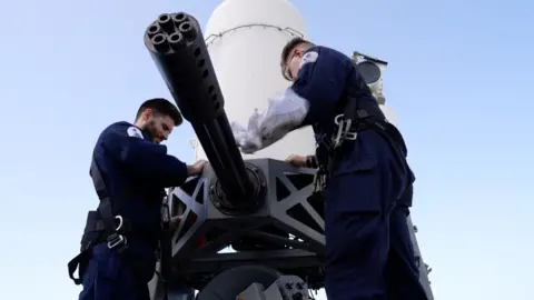 BBC/Maarten Lernout Sailors preparing Phalanx machine gun on HMS Diamond