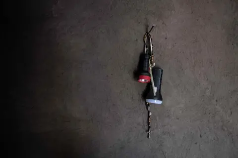 Tommy Trenchard Torches and a crucifix hang on a nail