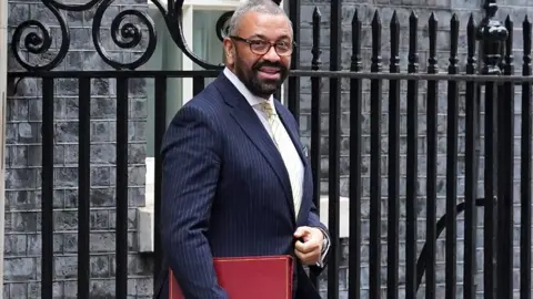 PA Media Home Secretary James Cleverly