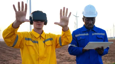 Getty Images Workers on site