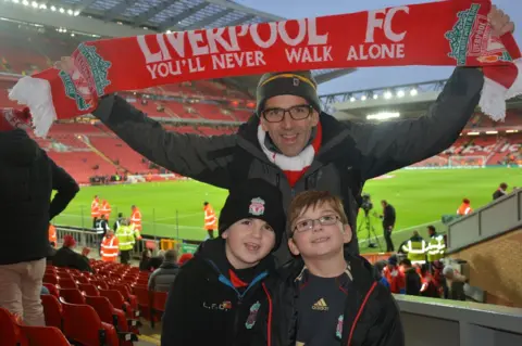Becky Williams Irfon Williams with his two sons at a Liverpool football match