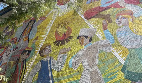BBC Mosaic of children dancing around a camp fire