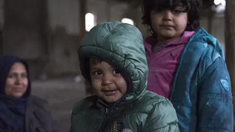 Getty Images Afghan child refugees in an abandoned building at the Serbian border. Hungary and Croatia have been stopping refugees crossing the borders into the EU, many refugees are stuck in Serbia, 11 November 2017