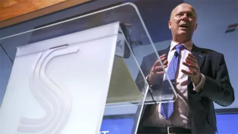 PA Transport Secretary Chris Grayling MP, gives his keynote speech at the Society of Motor Manufacturers and Traders