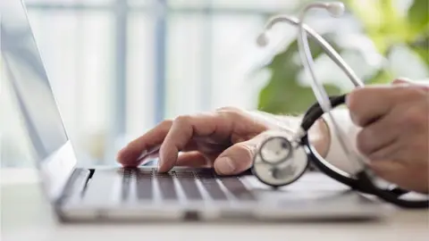 Getty Images Doctor working with laptop