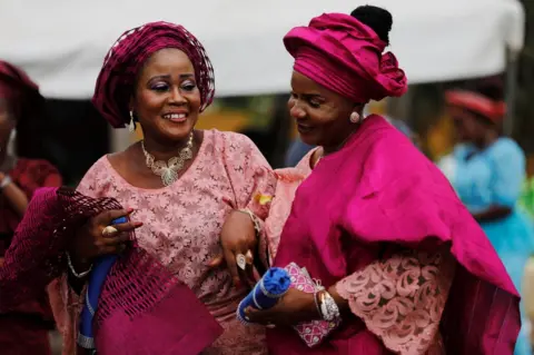 Reuters Women wearing traditional attires attend a traditional wedding at Ikeja marriage registry in Lagos, Nigeria, May 5, 2018
