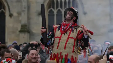 Getty Images The Haxey Fool is charged with starting the game