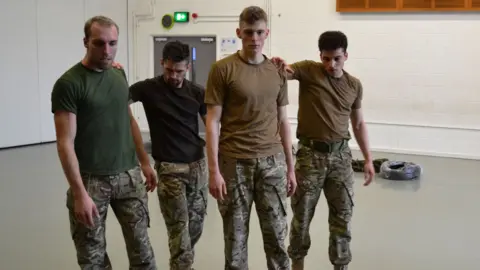 Rosie Kay Dance Company Alex Smith (third from left) in rehearsal